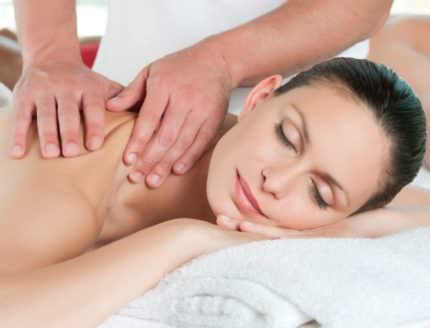 Beautiful young couple enjoy together a massage at spa centre