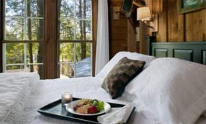 Moonshine Room with snack tray on bed with white bedspread