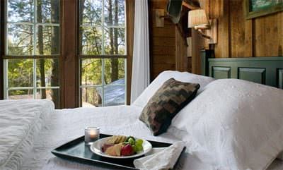 Moonshine Room with snack tray on bed with white bedspread