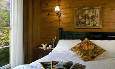 Minnehaha Room with decorative pillow on white bedspread