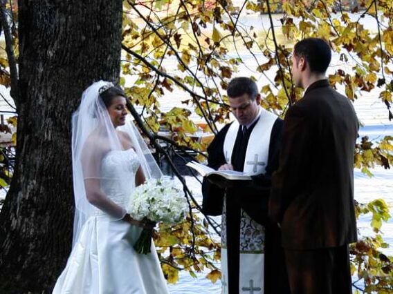 wedding ceremony on shore of lake