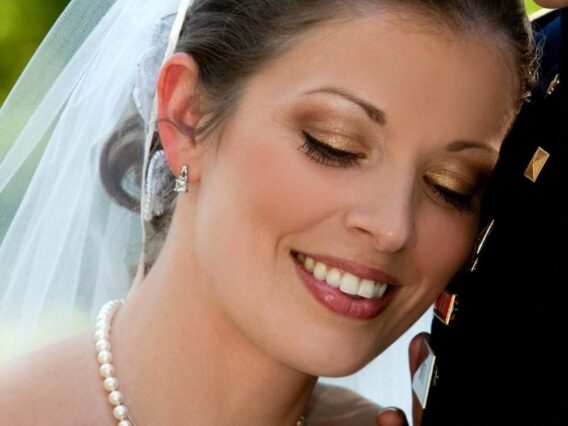bride leaning head against groom