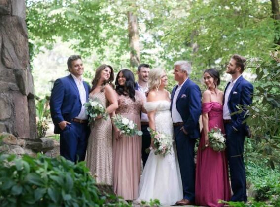 Smiling bride, groom, bridal party