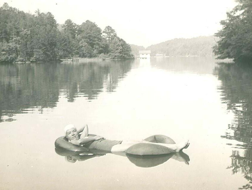 girl in a tube on lake