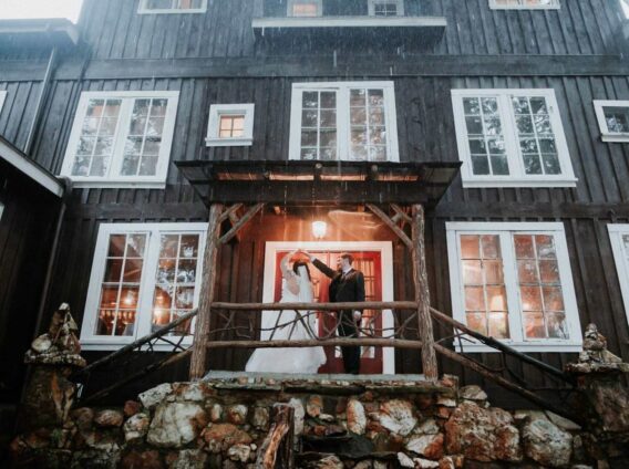 bridal couple dancing on rock porch