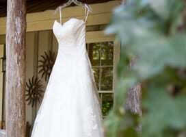 wedding gown hung from porch