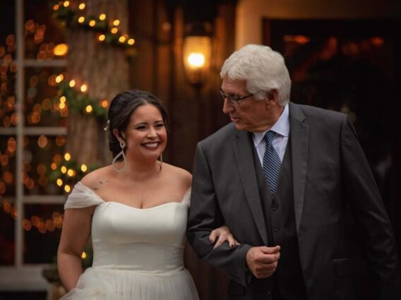 smiling bride and father